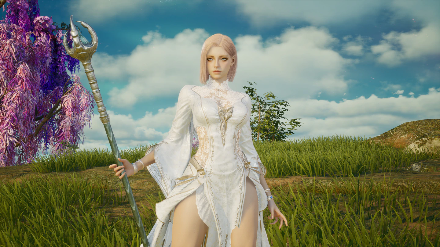 An AION 2 character in a long white and gold dress holding a tall ornate staff, standing in a grassy meadow beside a purple-blossom tree under a blue sky